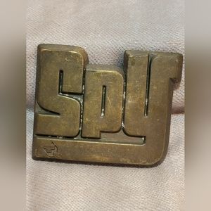 Spy Optic Vintage Belt Buckle that says SPY